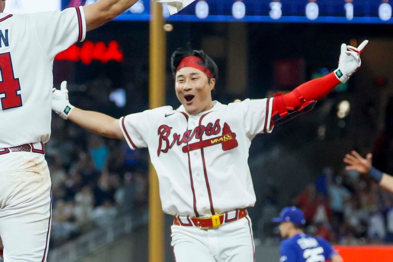 Braves shortstop Ha-Seong Kim celebrates after hitting a walk-off single in the ninth inning against the Los Angeles Dodgers on Wednesday, Aug. 26, 2026, at Truist Park in Atlanta. The Braves defeated the Dodgers, 6-5. (Miguel Martinez/AJC)