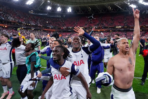Tottenham players celebrate their victory after the Europa League final soccer match between Tottenham Hotspur and Manchester United at the San Mamés Stadium in Bilbao, Spain, Wednesday, May 21, 2025. (AP Photo/Jose Breton)