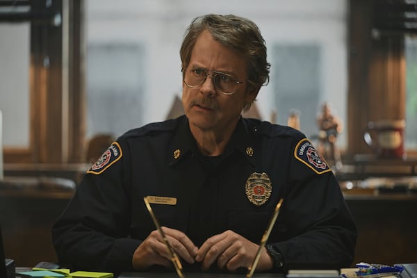 This image released by Apple TV+ shows Greg Kinnear in a scene from "Smoke." (Apple TV+ via AP)
