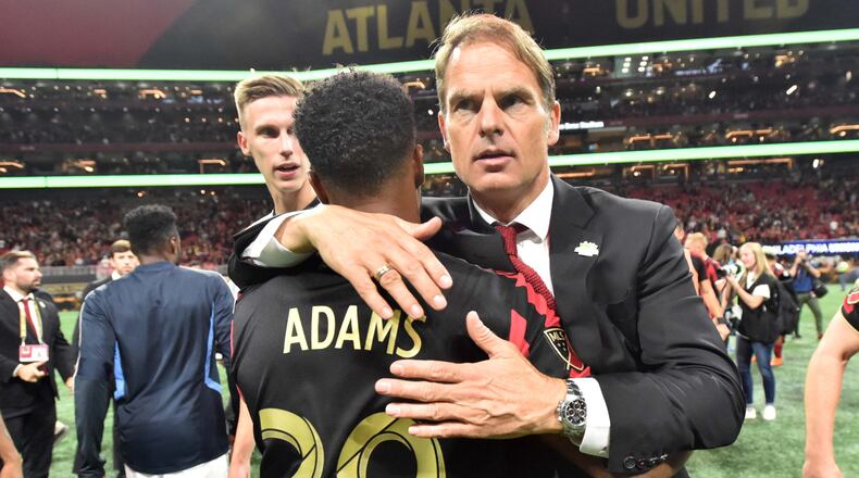 October 24, 2019 Atlanta - Atlanta United head coach Frank de Boer congratulates Atlanta United midfielder Mo Adams (29) after they beat the Philadelphia Union during Eastern Conference semifinals of MLS playoffs at Mercedes-Benz Stadium on Thursday, October 24, 2019. Atlanta United won 2-0 over the Philadelphia Union. (Hyosub Shin / Hyosub.Shin@ajc.com)