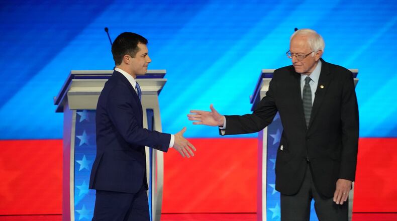 Former South Bend, Ind., Mayor Pete Buttigieg, left, and U.S. Sen. Bernie Sanders of Vermont are the front-runners heading into Tuesday’s vote in the New Hampshire Democratic primary. They have focused on each other while trying to deny giving any attention to the other candidates in the field. (Chang W. Lee/The New York Times)