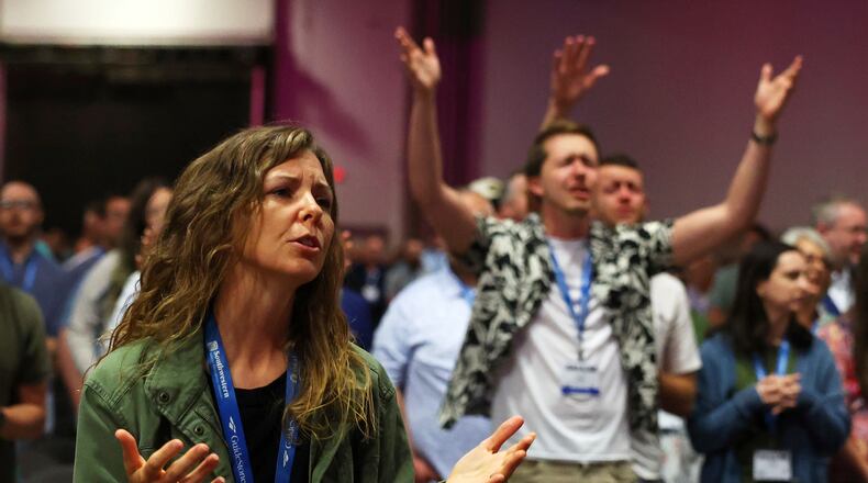 FILE - Messengers attending the Southern Baptist Convention participate in worship during the 2025 SBC Annual Meeting, June 10, 2025, in Dallas. (AP Photo/Richard W. Rodriguez, File)