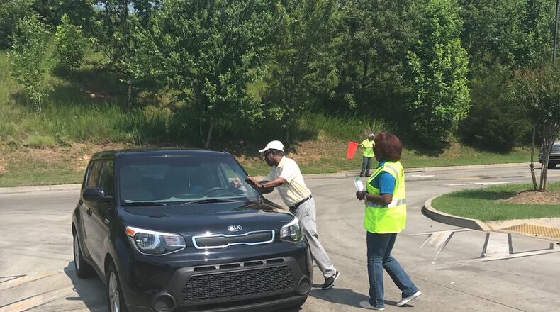 Paper shredding by only DeKalb residents will be allowed from 8 a.m. to noon June 11 at the DeKalb Sanitation Division's Central Transfer Station, 3720 Leroy Scott Drive, Decatur. DeKalb CEO Michael Thurmond and DeKalb Sanitation Division Director Tracy Hutchinson greet participants at the June 9, 2020 paper shredding event. CONTRIBUTED