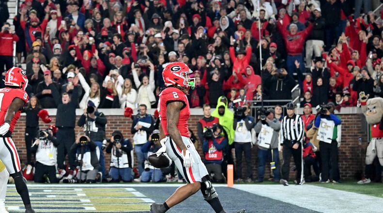 Georgia running back Kendall Milton (2) scores a touchdown during the second half of an NCAA college football game at Georgia Tech's Bobby Dodd Stadium, Saturday, November 25, 2023, in Atlanta. Georgia won 31-23 over Georgia Tech. (Hyosub Shin / Hyosub.Shin@ajc.com)