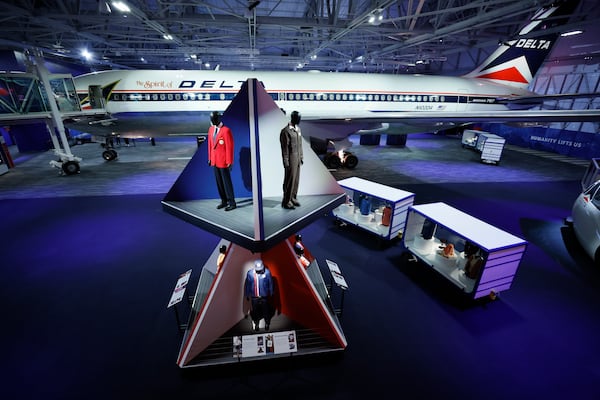 A selection of Delta employee uniforms are on display in the Delta Flight Museum on Tuesday, March 25, 2025. (Miguel Martinez/AJC)