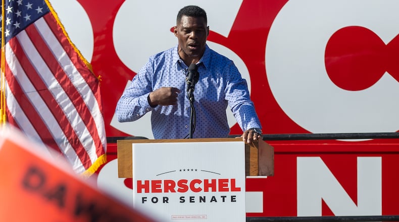 U.S. Senate hopeful Herschel Walker talks to the crowd during a Smyrna rally with Gov. Brian Kemp Saturday, November 19, 2022.   (Steve Schaefer/steve.schaefer@ajc.com)
