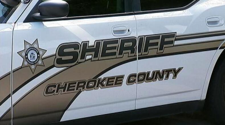 Authorities are searching for three  suspects accused of pulling a gun on a Cherokee County homeowner who confronted them in his driveway overnight.