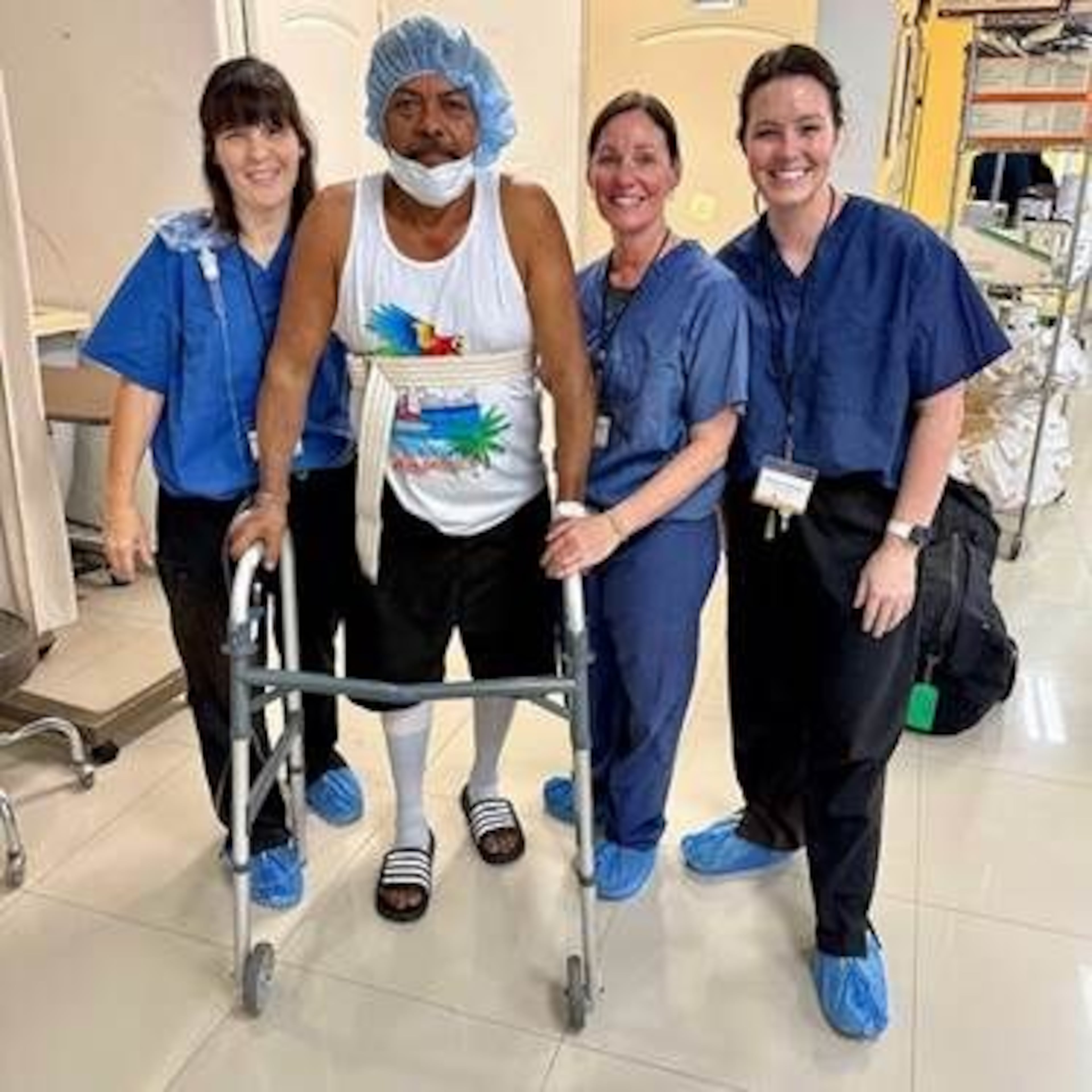 Medical team members assist a patient in Honduras. Honduran doctors will prescribe the implant, but patients are responsible for paying for it themselves. (Courtesy of Dr. Stephen Smith)