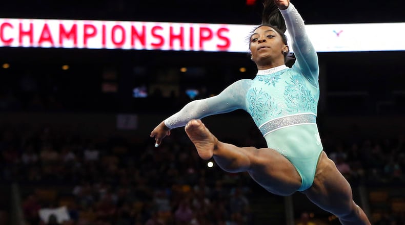 Simone Biles competes on the floor exercise at the U.S. Gymnastics Championships, Sunday, Aug. 19, 2018, in Boston.