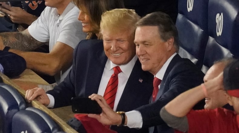 Sen. David Perdue, R-Ga., takes a selfie with President Donald Trump during the seventh inning of Game 5 of the baseball World Series between the Houston Astros and the Washington Nationals Sunday, Oct. 27, 2019, in Washington.