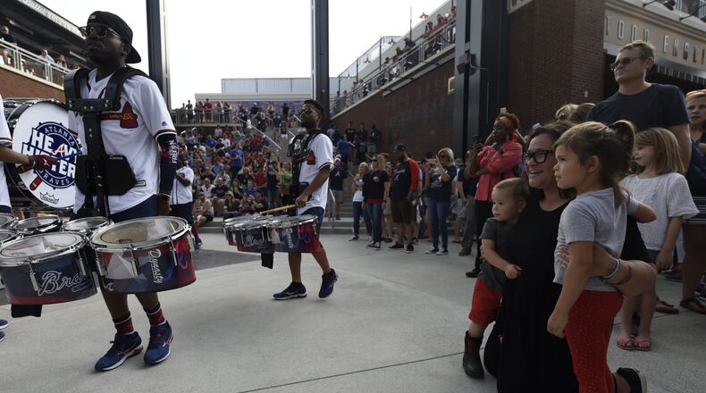 In this photo from the opening game at SunTrust Park, fans watch as the Atlanta Braves Heavy Hitters Drumline performs. Any Braves game has plenty of family fun, but the July 4th game against the Houston Astros also will include patriotic elements and fireworks. HENRY TAYLOR / HENRY.TAYLOR@AJC.COM