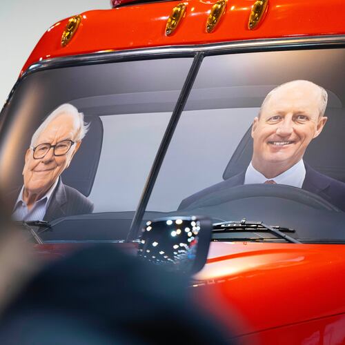 FILE - Portraits of Berkshire Hathaway's Warren Buffett, left, and CEO Greg Abel sit in a semi truck at the Pilot display in the Berkshire Hathaway annual meeting on May 2, 2026, in Omaha, Neb. (AP Photo/Rebecca S. Gratz, file)