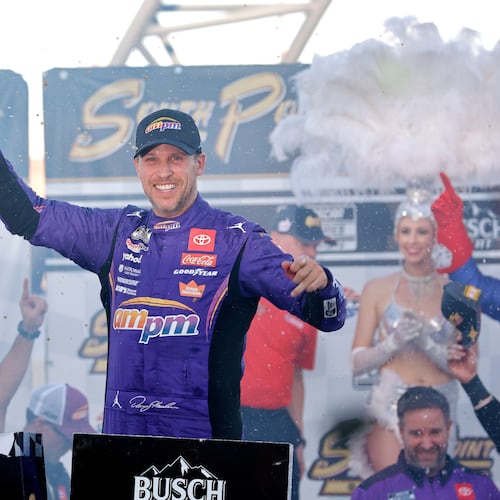 Denny Hamlin celebrates in victory lane after winning a NASCAR Cup Series auto race Sunday, Oct. 12, 2025, in Las Vegas. (AP Photo/Steve Marcus)