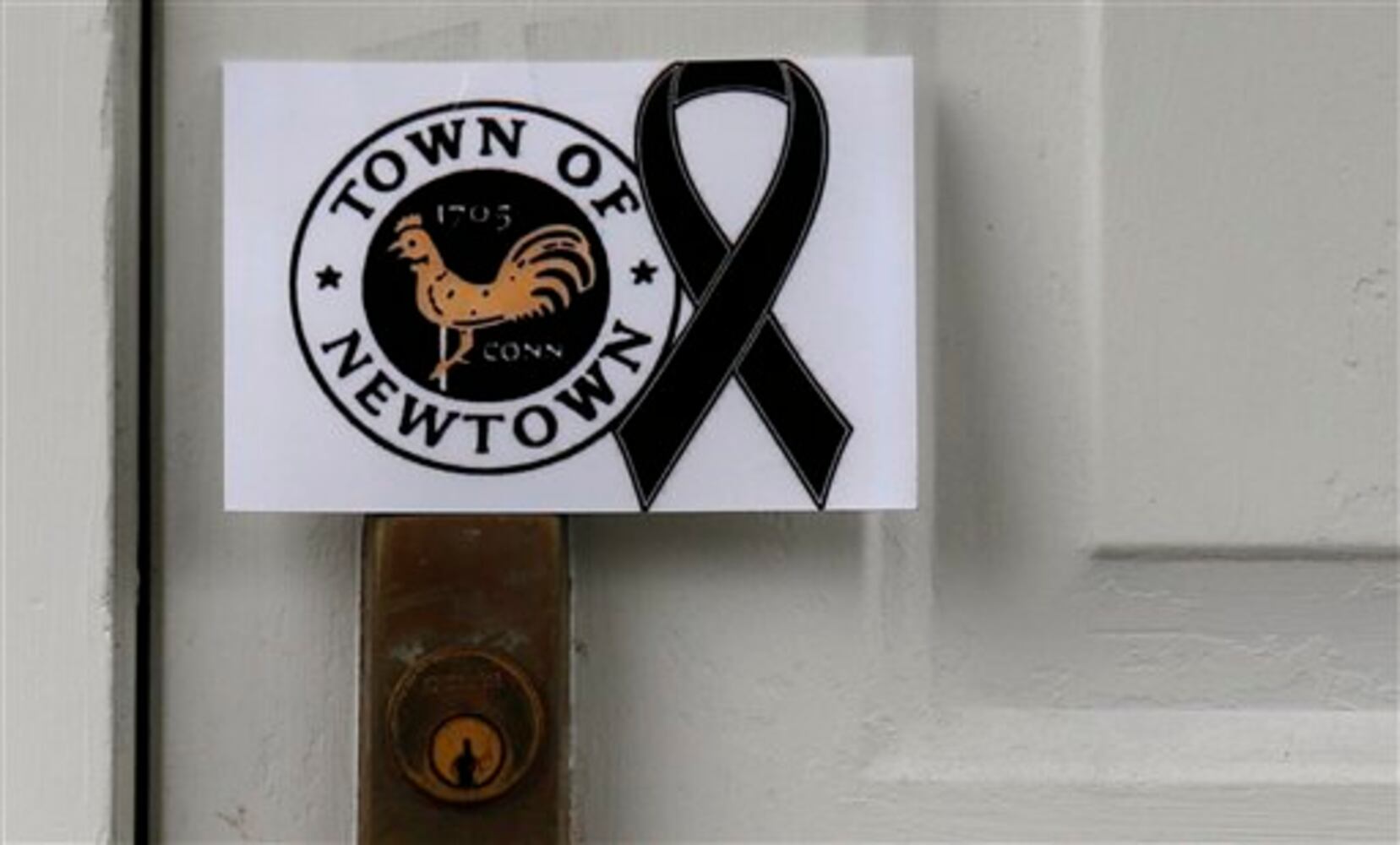 Newtown holds the first funerals for the victims