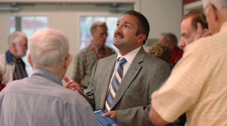 071024 KENNESAW, GA (NORTH COBB): Mark Mathews, a candidate for mayor in the city of Kennesaw, is shown in a Wednesday 10/24/07 photo as he chats with folks during a meeting of the Kiwanis Club Kennworth where he was guest speaker today. Mathews has been a member of the Kennesaw City Council for 12 years and is taking on incumbent Leonard Church. The group meets at the North Cobb Senior Center. Goes with a story by Aixa Pascual on the Kennesaw mayoral race. PHOTO BY SHARP/STAFF. Kennesaw Mayor Mark Mathews. AJC file