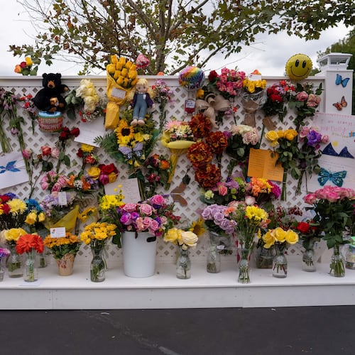 A memorial wall for Dolly Parton stands outside the Dollywood theme park in Pigeon Forge, Tenn., Wednesday, Aug. 26, 2026. (AP Photo/Camden Hall)