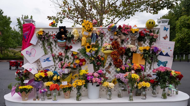 A memorial wall for Dolly Parton stands outside the Dollywood theme park in Pigeon Forge, Tenn., Wednesday, Aug. 26, 2026. (AP Photo/Camden Hall)
