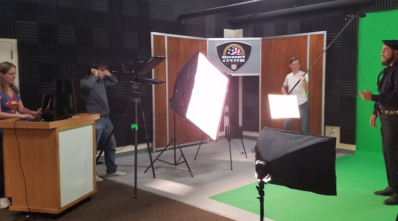 Alison Reeger-Cook, David Cook and Ken Johnson (left to right) film a history lesson with actor Jonathan Perkins as part of the Northeast Georgia History Center’s new “virtual field trip” program.