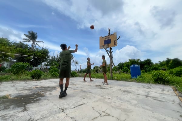 Philippine marines play basketball at West York Island, locally called Likas island, on one of the Philippine occupied islands in the disputed South China Sea on June 5, 2025. (AP Photo/Jim Gomez)