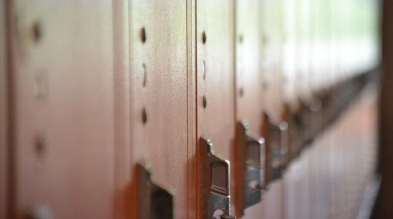 A Georgia middle school teacher has been arrested after officials say he assaulted a student in a hallway in front of other teachers. (AJC file photo)