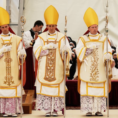 Newly consecrated Bishops, from left, Marc Hanappier, Michel Poinsinet de Sivry, Michael Goldade and Pascal Schreiber wearing their miters and holding their pastoral staffs, stand at the end of their consecration ceremony in a tent set up outside the Society of St. Pius X seminary in Econe, Switzerland, Wednesday, July 1, 2026. (AP Photo/Baz Ratner)