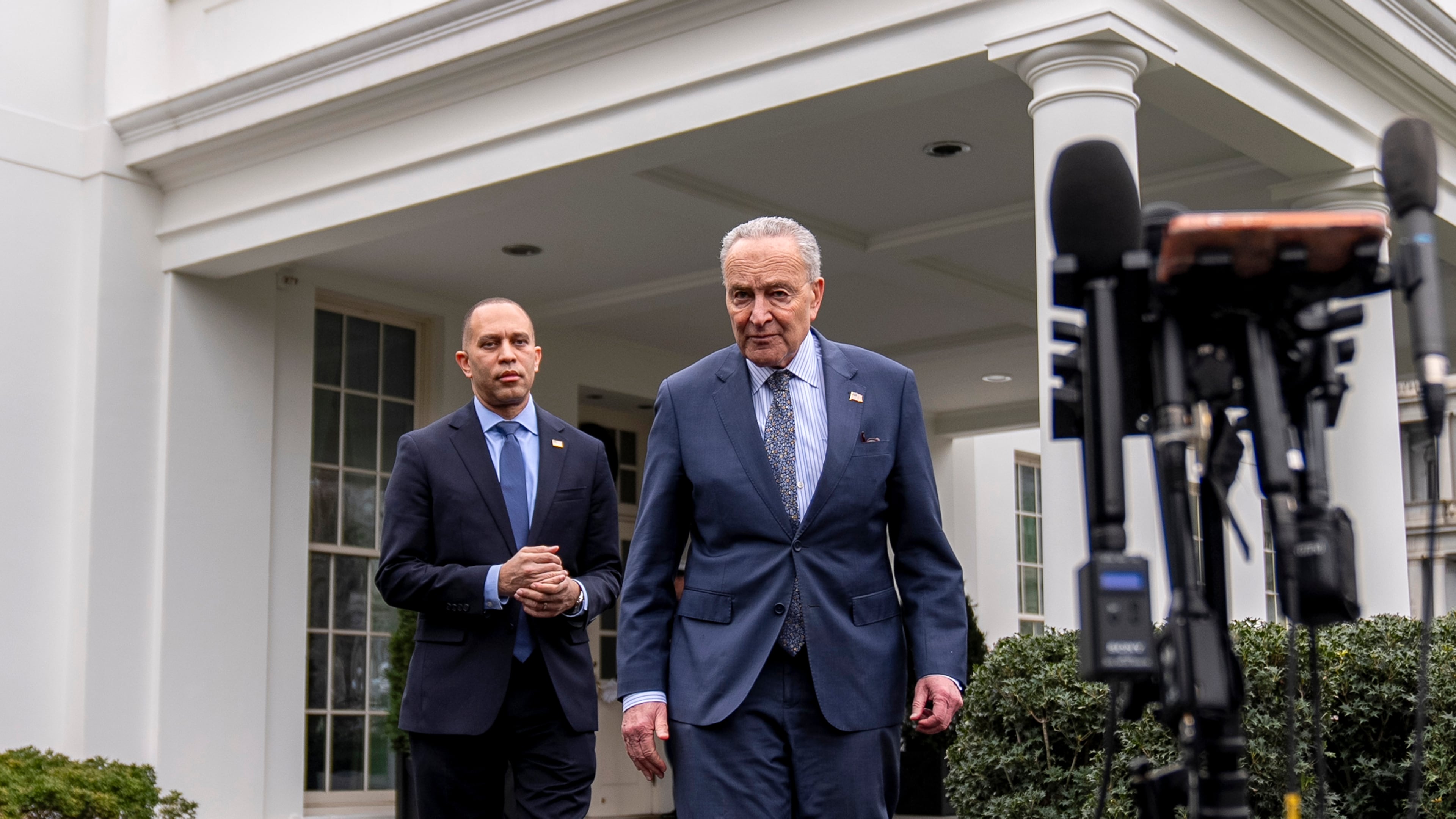FILE—Sen. Chuck Schumer, D-N.Y., and Rep. Hakeem Jeffries, D-N.Y., left, arrive to speak to members of the media outside the West Wing at the White House in Washington, Tuesday, Feb. 27, 2024. (AP Photo/Andrew Harnik, file)