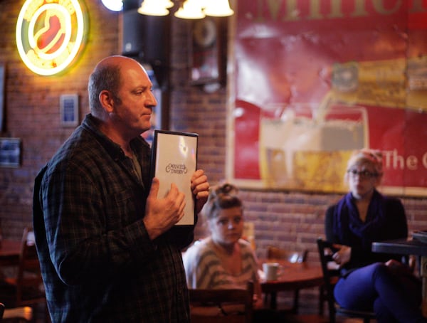 Manuel's owner Brian Maloof (left) explains how to handle the menu changes during a staff meeting in 2020. (Bob Andres/AJC)