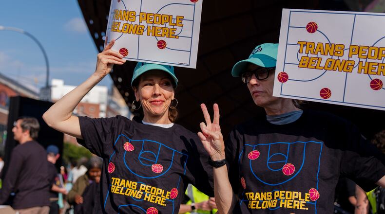 FILE - Demonstrators rally in support of transgender athletes in women's sports outside of Barclay's Center before the WNBA basketball game between the Indiana Fever and the New York Liberty, Aug. 22, 2026, in New York. (AP Photo/Angelina Katsanis, File)