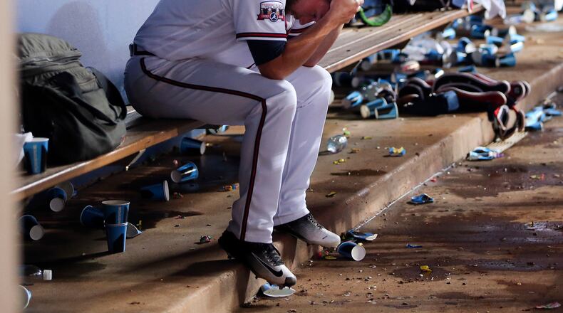 Atlanta Braves starting pitcher Bud Norris (20) sits on the bench during the Braves' half of the eighth inning of baseball game against the Milwaukee Brewers on Tuesday, May 24, 2016, in Atlanta. Norris allowed the go-ahead run in the eighth. (AP Photo/John Bazemore)