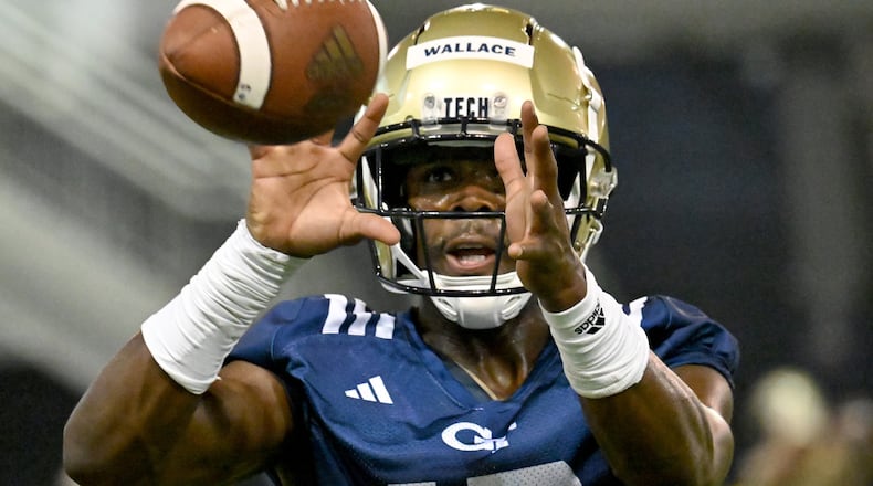Georgia Tech defensive back K.J. Wallace (16) catches a ball during a practice at Georgia Tech’s indoor practice facility, Tuesday, August 1, 2023, in Atlanta. (Hyosub Shin / Hyosub.Shin@ajc.com)