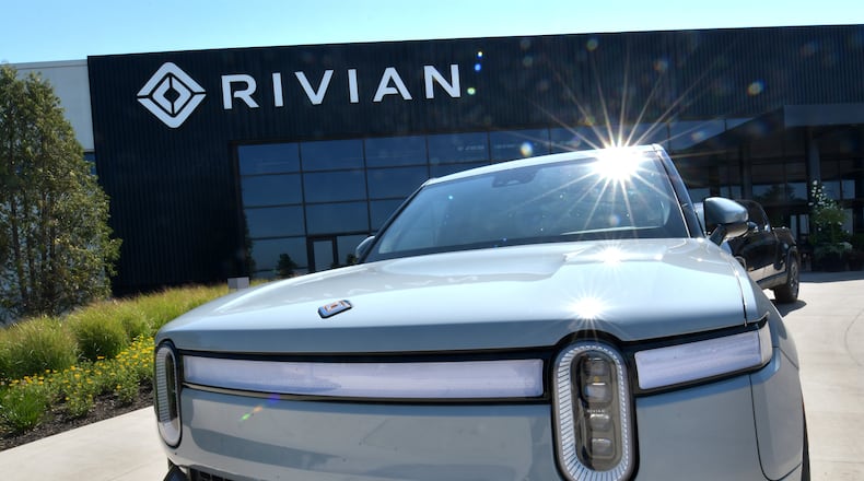 The R1T electric vehicle sits outside the Rivian plant in Normal, Illinois. The electric truck and SUV makersaid Friday it is recalling almost all the vehicles it has delivered to customers in order to tighten a loose fastener that could potentially affect drivers’ ability to steer. (Photo for The Atlanta Journal Constitution by Ron Johnson)