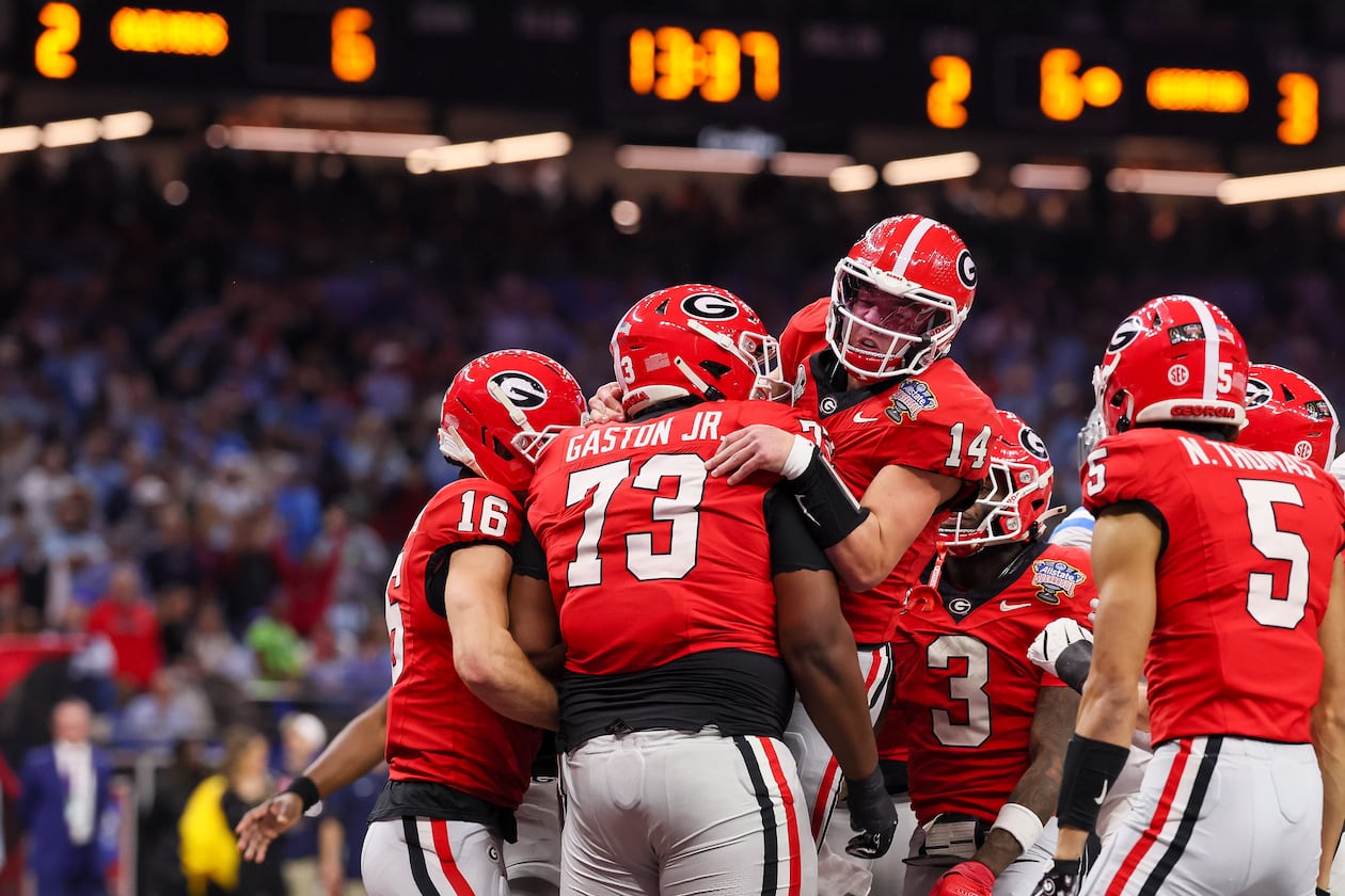 Georgia Bulldogs quarterback Gunner Stockton celebrates a 12-yard touchdown run against the Ole Miss Rebels during the second quarter of the NCAA College Football Playoff quarterfinal game at the Sugar Bowl in the Caesars Superdome, Thursday, Jan. 1, 2026, in New Orleans. (Jason Getz/AJC)