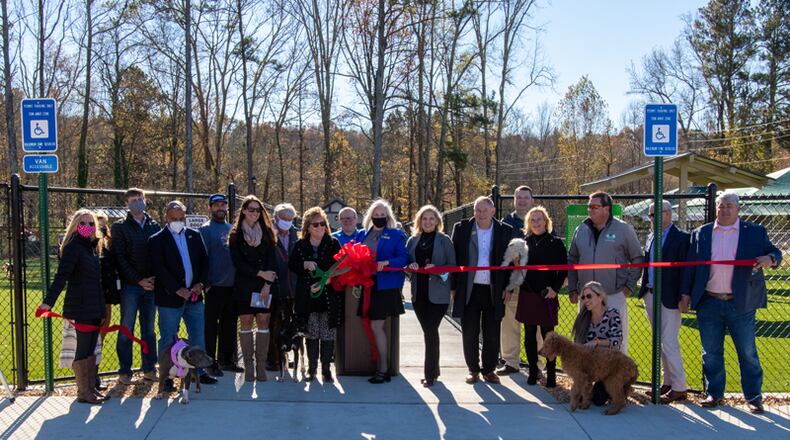 Forsyth County officials and guests cut the ribbon for the new Coal Mountain Dog Park, across from the Forsyth County Animal Shelter.