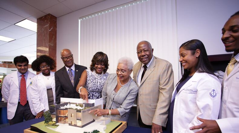 In 2015, baseball legend Hank Aaron and his wife, Billye Suber Aaron, announced a $3 million gift to Morehouse School of Medicine to expand the Hugh Gloster Medical Education building and create the Billye Suber Aaron Student Pavilion. The gift was presented during the school’s 40th anniversary and 31st fall convocation, white coat and pinning ceremony. (Courtesy of Morehouse School of Medicine)