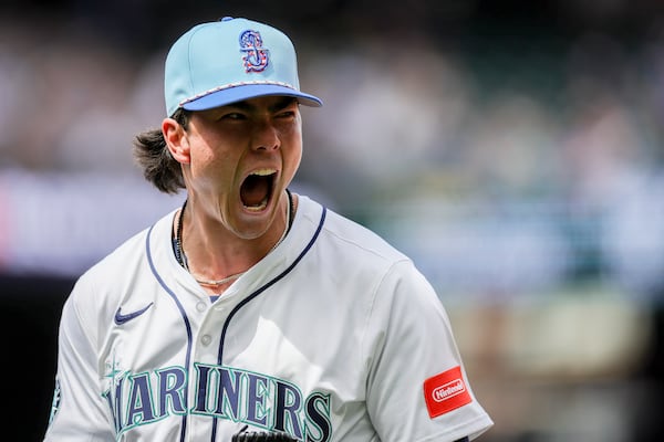Seattle Mariners starting pitcher Bryan Woo reacts after Pittsburgh Pirates' Nick Gonzales was called out at first base during the sixth inning of a baseball game Friday, July 4, 2025, in Seattle. (AP Photo/Ryan Sun)