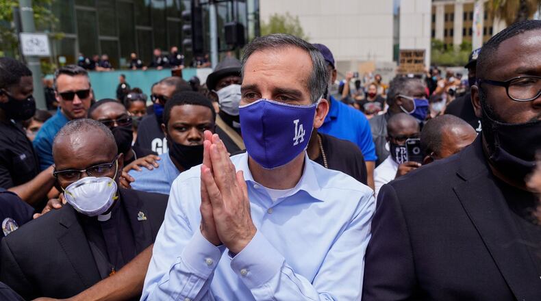 Los Angeles Mayor Eric Garcetti walks out to address protesters and clergy members in downtown Los Angeles outside of Los Angeles City Hall and LAPD Headquarters on Tuesday, June 2, 2020. (Kent Nishimura/Los Angeles Times/TNS)