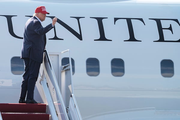 President Donald Trump waves as he boards Air Force One at Joint Base Andrews, Md., Tuesday, July 1, 2025, for a trip to visit a new migrant detention center in Ochopee, Fla. (AP Photo/Cliff Owen)