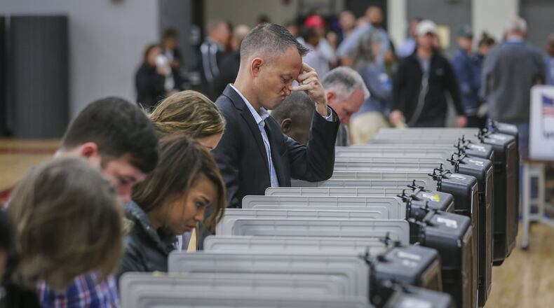 Five Fulton County voters cast their ballots twice. JOHN SPINK /JSPINK@AJC.COM AJC File Photo