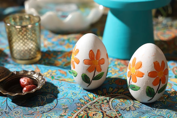 Eggs appear on a ceremonial table at the Persian Cultural Center of Atlanta. Families often decorate the eggs for Nowruz, the Persian new year. (Arvin Temkar/AJC)