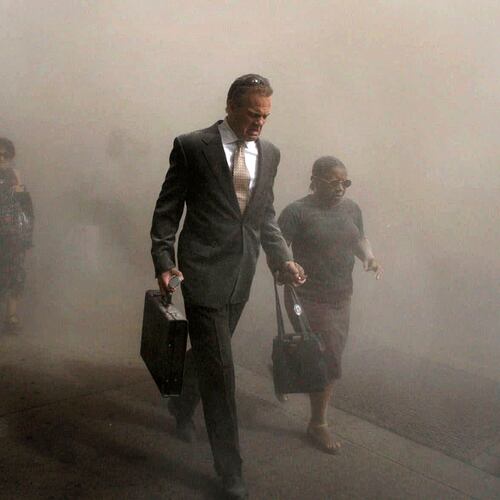 FILE - Pedestrians flee the area of New York's World Trade Center in lower Manhattan on Tuesday, Sept. 11, 2001. (AP Photo/Amy Sancetta, FIle)