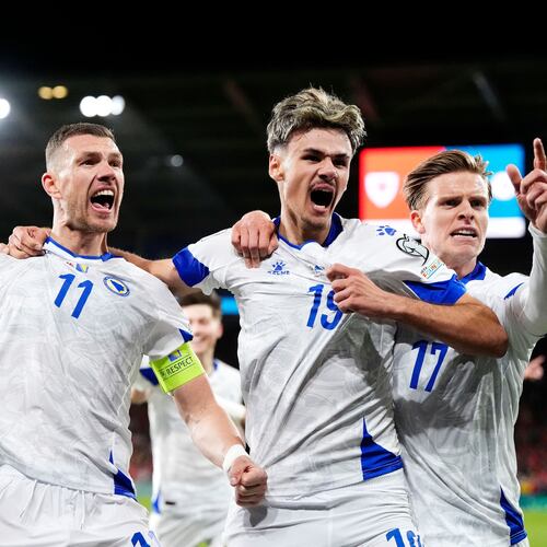 Bosnia and Herzegovina's Edin Dzeko, left, celebrates with team-mates after scoring their side's first goal during the World Cup playoff semifinal soccer match between Wales and Bosnia and Herzegovina in Cardiff, Wales, Thursday, March 26, 2026. (Nick Potts/PA via AP)