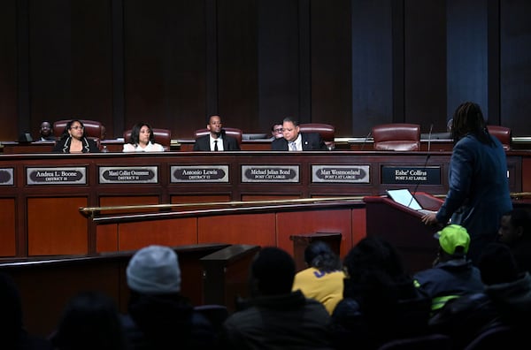 Council members (from left) Andrea Boone, Marci Collier Overstreet, Antonio Lewis and Michael Julian Bond listen to a speaker during public comments at a City Council meeting at Atlanta City Hall, Thursday, January 23, 2025. (Hyosub Shin/AJC)