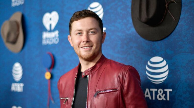 Country singer Scotty McCreery married his longtime girlfriend in the North Carolina mountains on Saturday.