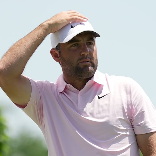 Scottie Scheffler watches his tee shot from the fifth tee during the first round of the Memorial golf tournament in Dublin, Ohio, Thursday, June 4, 2026. (AP Photo/Sue Ogrocki)