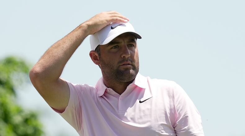 Scottie Scheffler watches his tee shot from the fifth tee during the first round of the Memorial golf tournament in Dublin, Ohio, Thursday, June 4, 2026. (AP Photo/Sue Ogrocki)