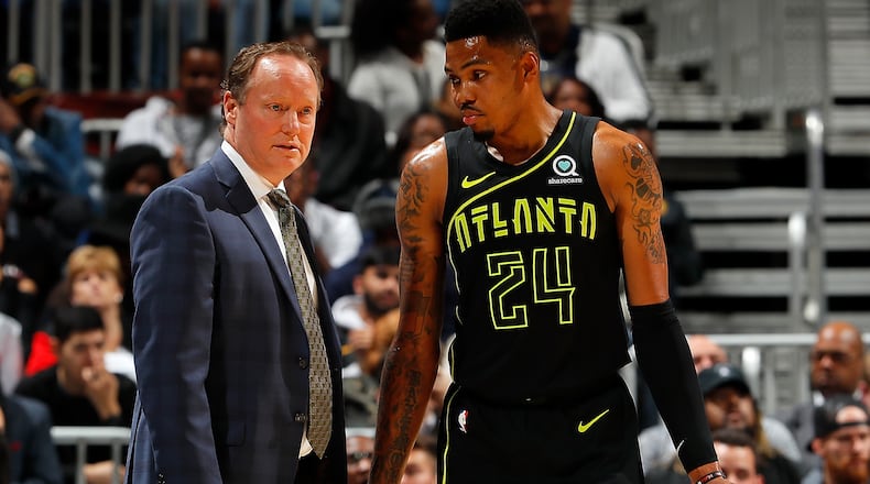 ATLANTA, GA - FEBRUARY 09: Kent Bazemore #24 of the Atlanta Hawks converses with Mike Budenholzer after he was charged with a technical foul during the game against the Cleveland Cavaliers at Philips Arena on February 9, 2018 in Atlanta, Georgia. NOTE TO USER: User expressly acknowledges and agrees that, by downloading and or using this photograph, User is consenting to the terms and conditions of the Getty Images License Agreement. (Photo by Kevin C. Cox/Getty Images)