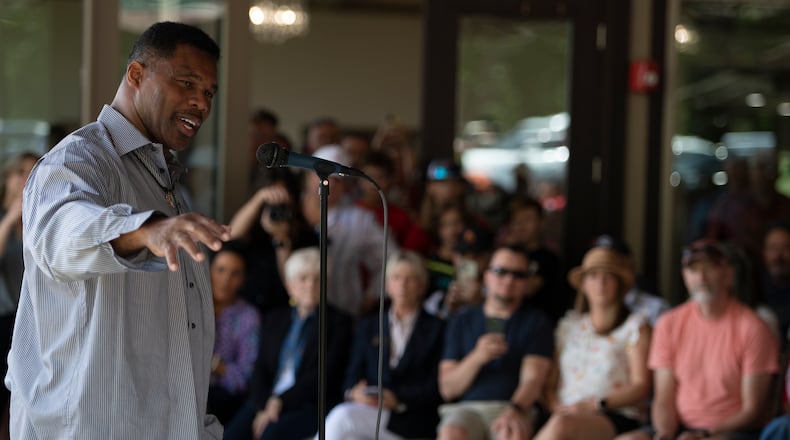 Republican Senate canididate Herschel Walker speaks to supporters during a campaign stop, Saturday, May 14, 2022, in Ellijay, Ga. (AP Photo/Mike Stewart, Pool)
