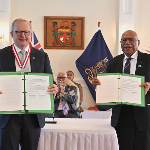 Australia's Prime Minister Anthony Albanese, left, and Fiji's Prime Minister Sitiveni Rabuka display a new bilateral defense alliance they have just signed at State House in Suva, Fiji, Monday, July 6, 2026. (Mick Tsikas/AAP Image via AP)