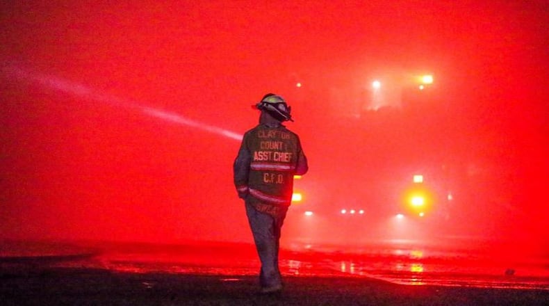 Fire crews were still on the scene of a two-alarm blaze near Southlake Mall early Friday. JOHN SPINK / JSPINK@AJC.COM