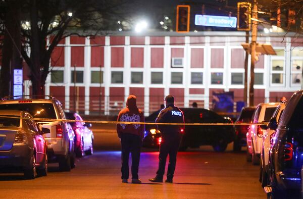 Law enforcement officers investigate the scene after two police officers were shot in Newark, N.J., on Friday, March 7, 2025. (Ed Murray/NJ Advance Media via AP)